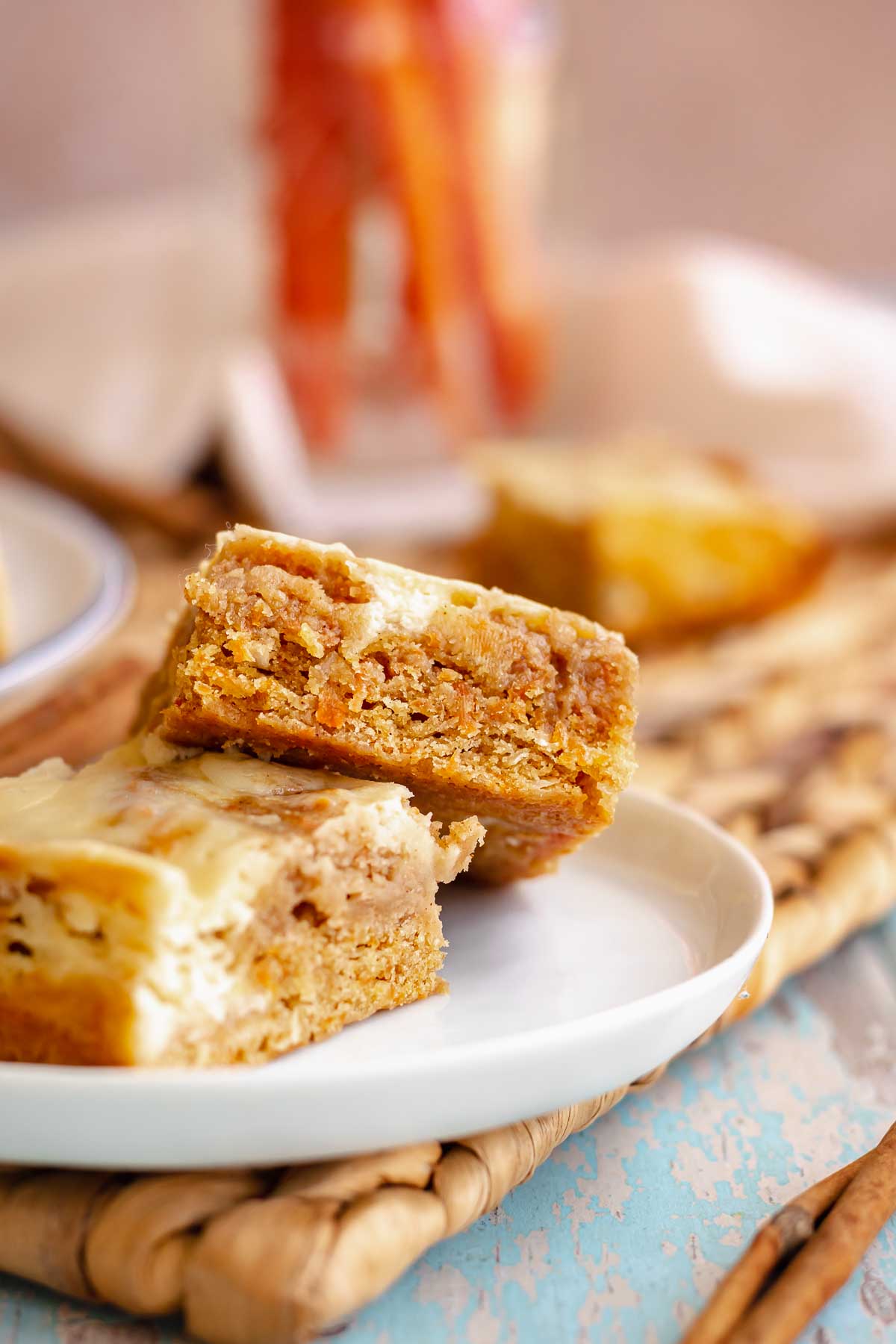 Carrot cake blondies leaning on each other on a plate.
