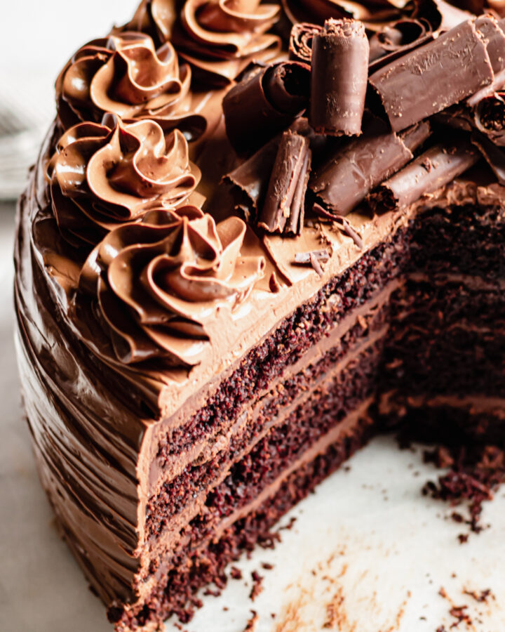 Triple Chocolate Layer Cake slices open to reveal the layers