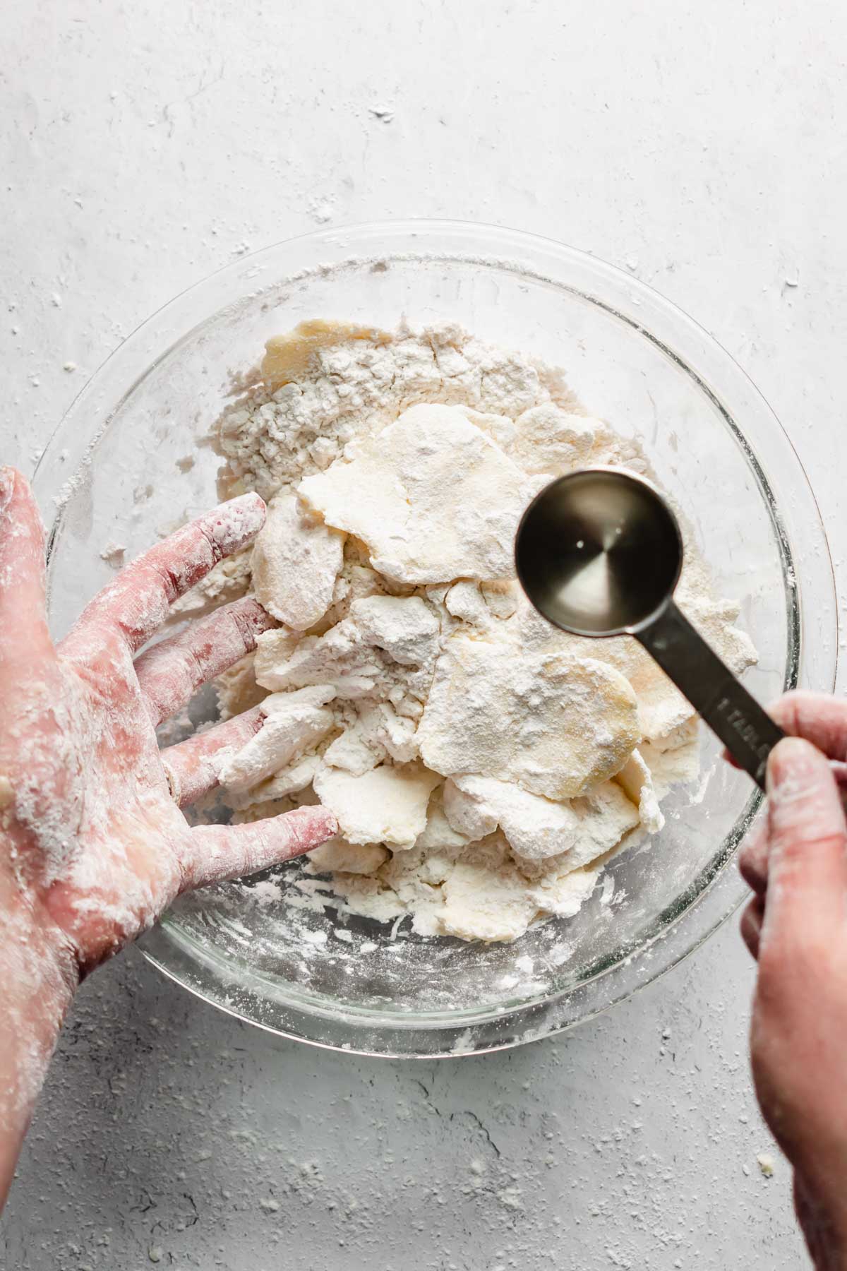 A tablespoon of water is added to the butter and flour.