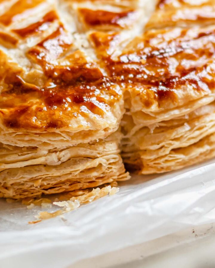 Flaky baked layers of rough puff pastry.