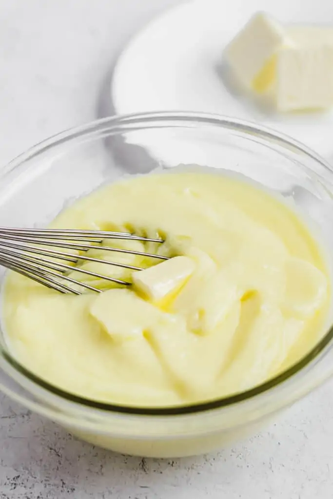 Butter being whisked into the pastry cream