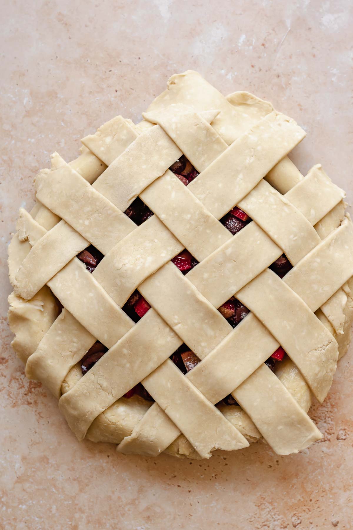 Lattice strips on top of the pie with overhangs.