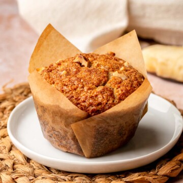 A banana muffin on a plate.