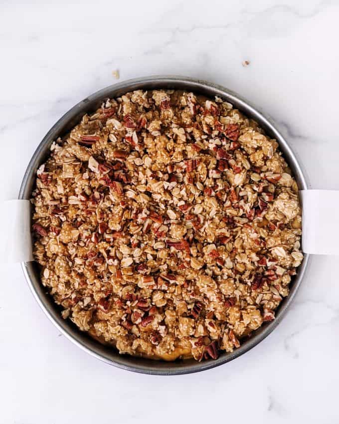 A top down shot of the full crumble topping, including pecans. 
