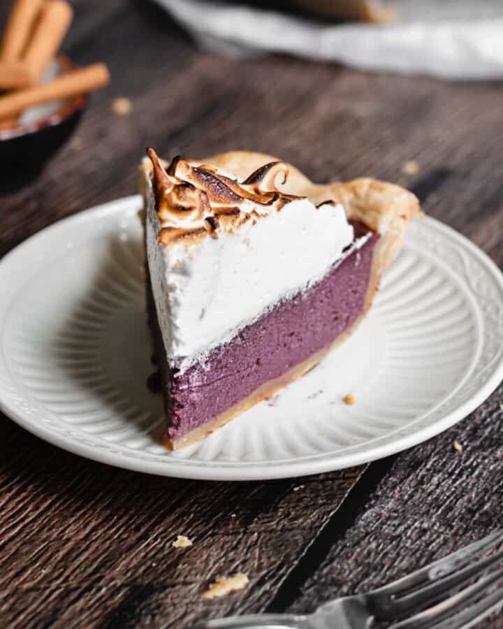 One slice of purple sweet potato pie on a plate