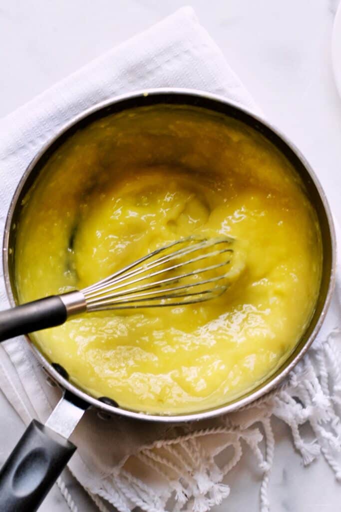 Thickened lemon curd in a saucepan