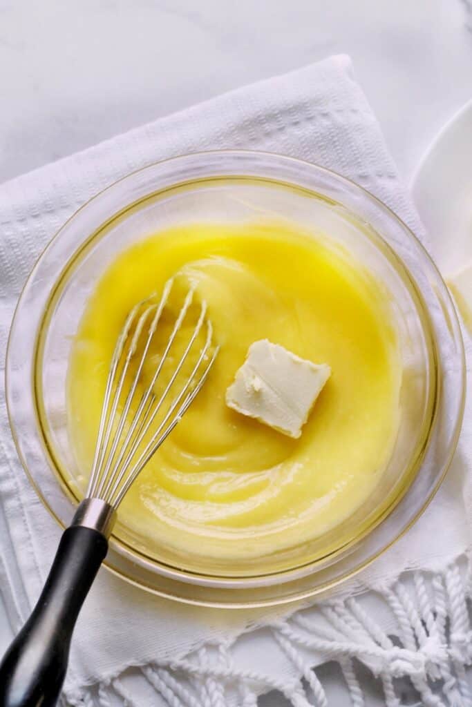 Butter in a bowl of lemon curd.