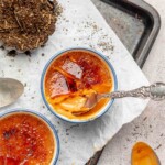 Thai tea creme brûlée with a spoon into the cracked top.