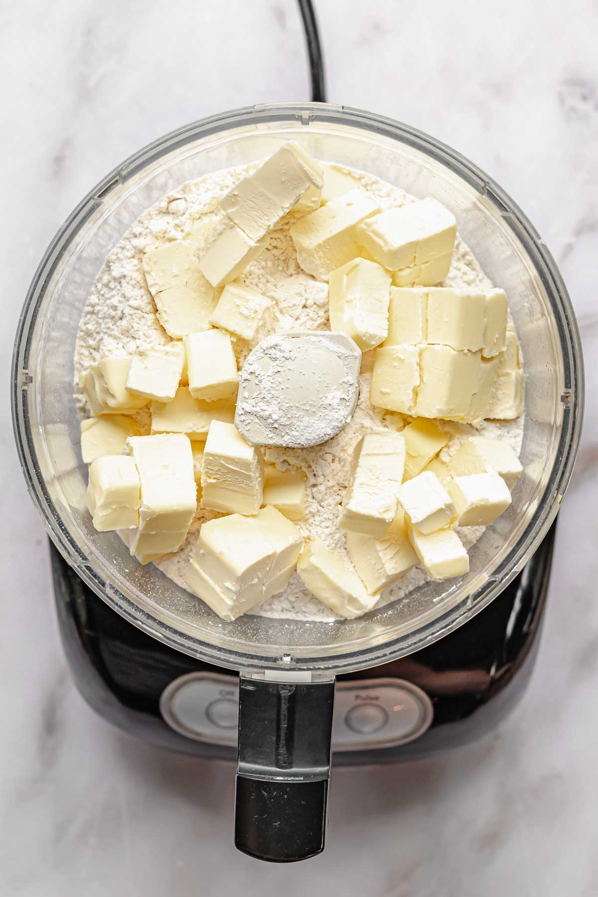 Butter in a food processor with flour.