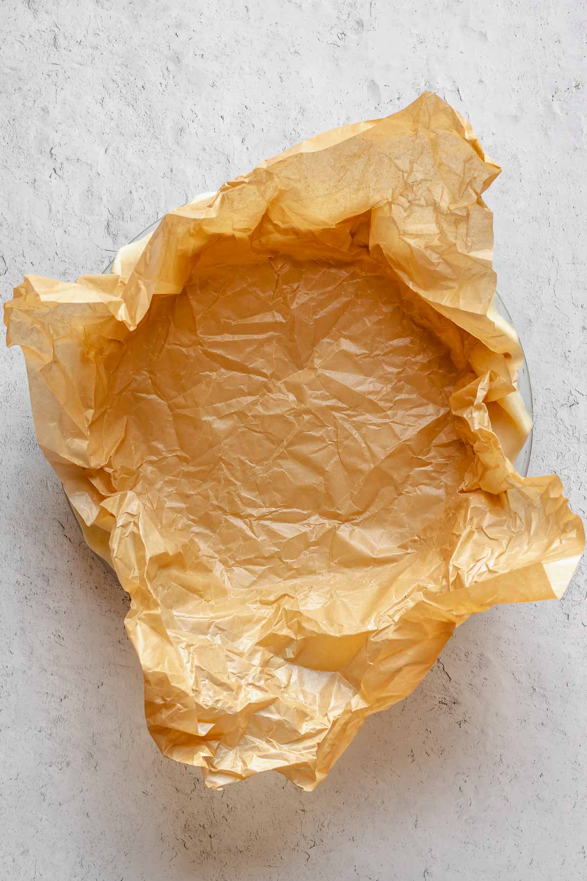 Parchment paper set into pie crust.