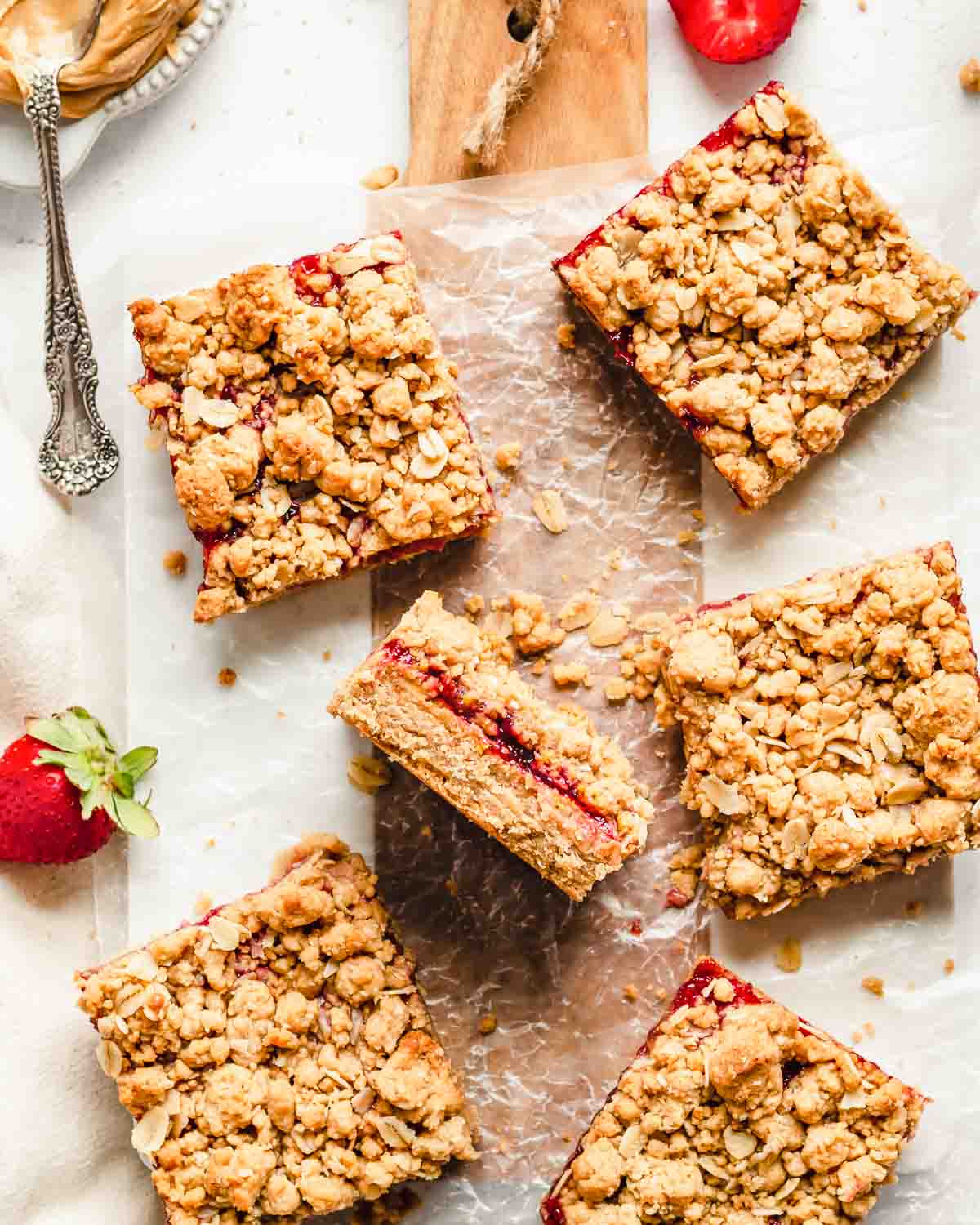 Peanut butter jelly bars on a cutting board.