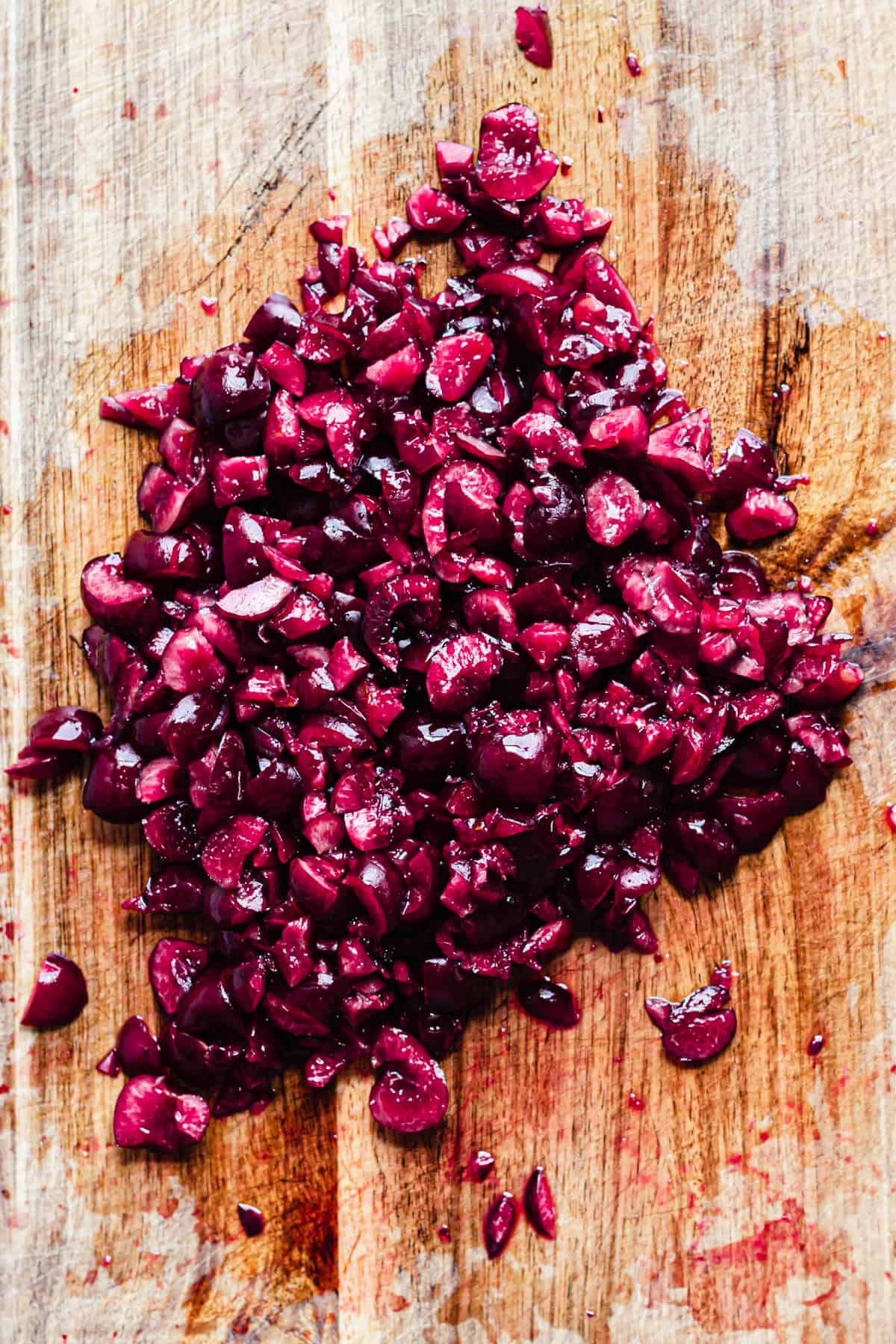 Close up shot of pitted and chopped fresh cherries.