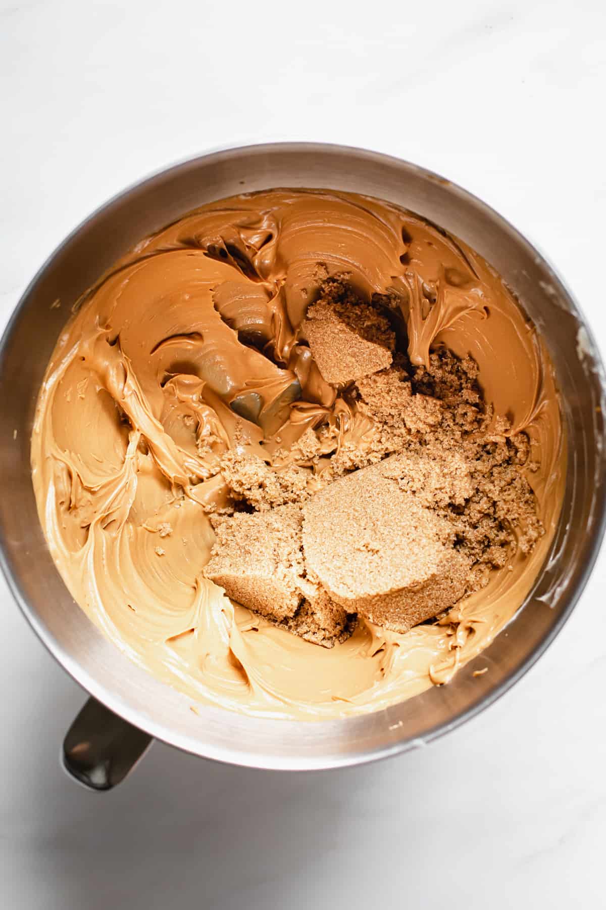 dark brown sugar is added to the creamed cookie butter and butter