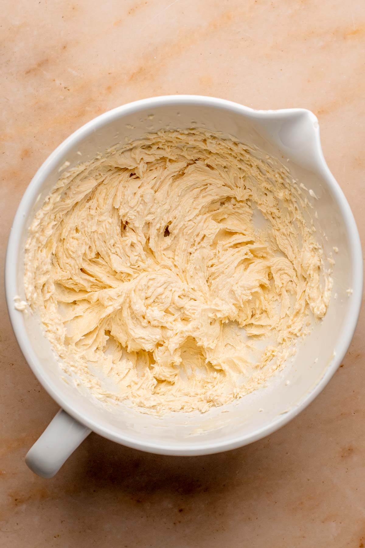 Creamed butter and sugar in a bowl.