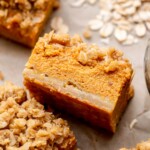 A square of pumpkin pie bars laying on its side.