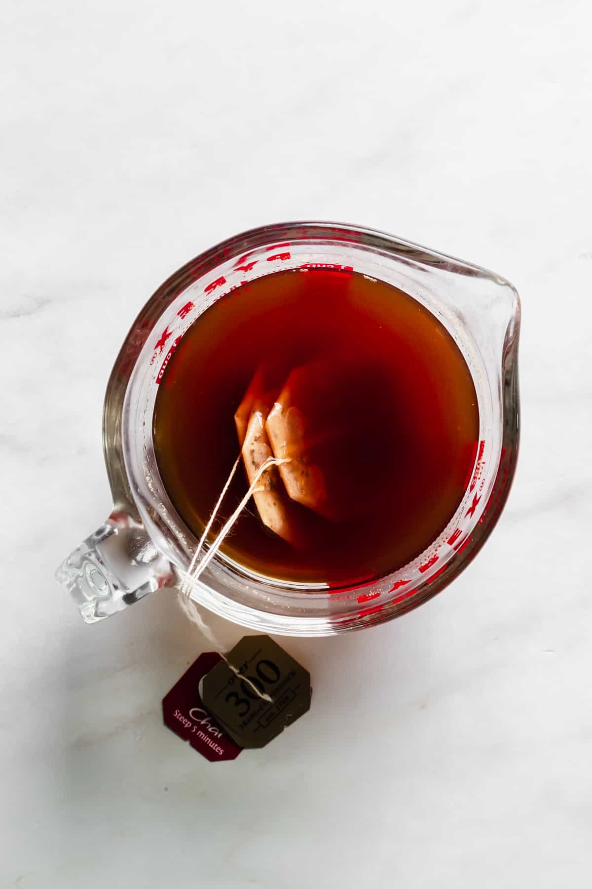 Overhead shot of tea bags steeping in a bowl.