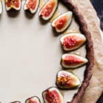 Overhead shot of the cinnamon Panna Cotta Tart with sliced figs and honey