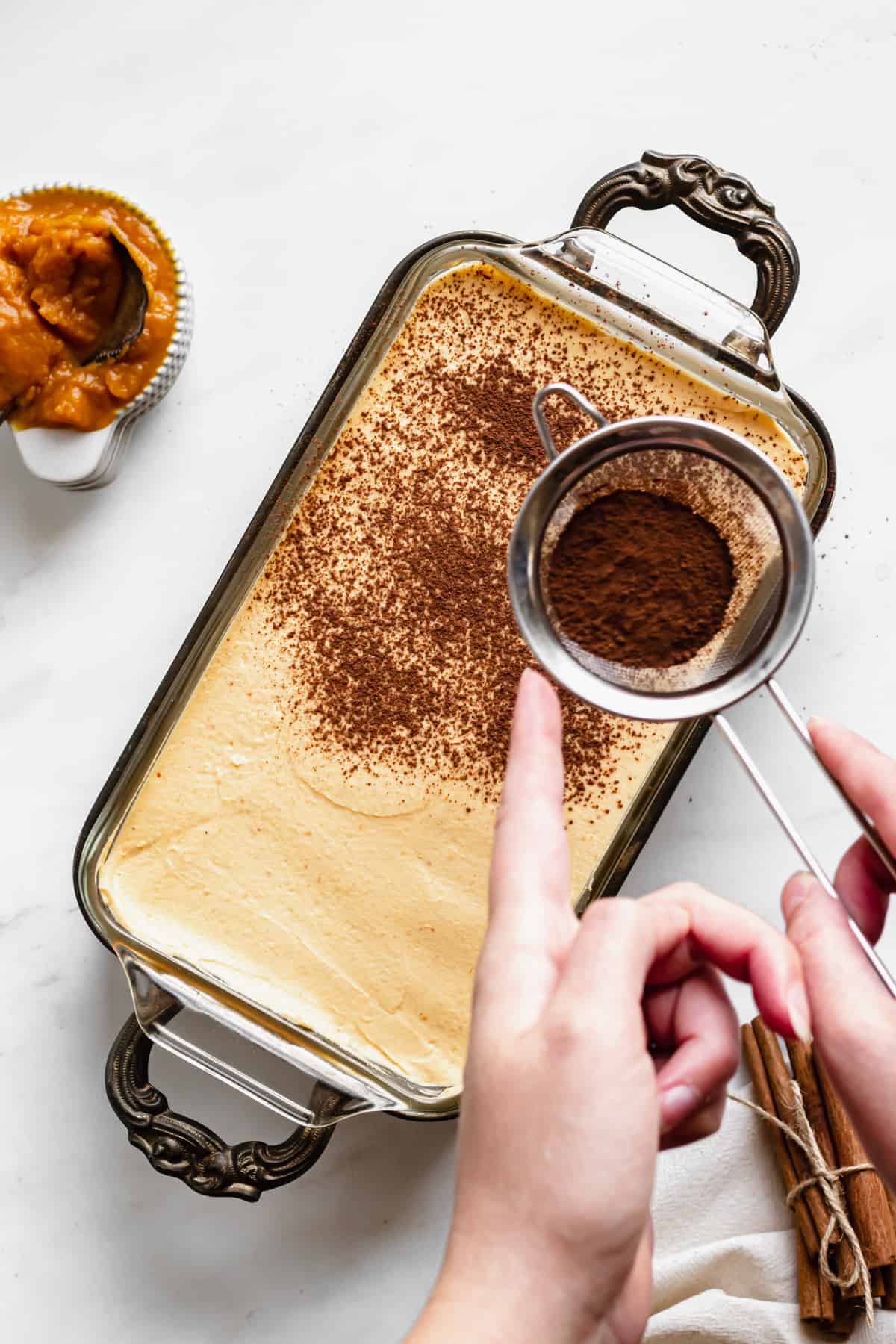 Cocoa powder and cinnamon dusted on top of the pumpkin chai tiramisu