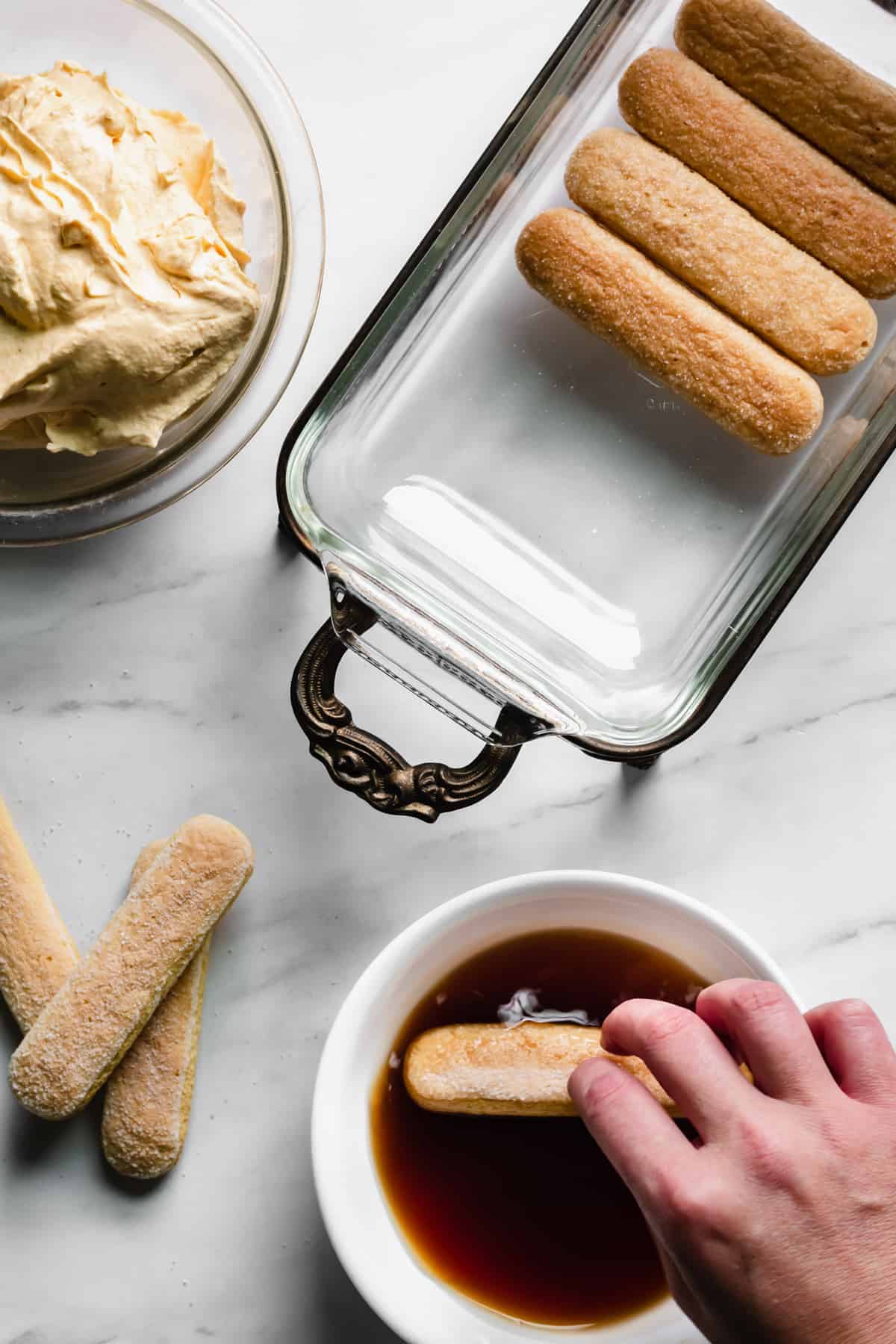 One lady finger gets dipped into the chai.