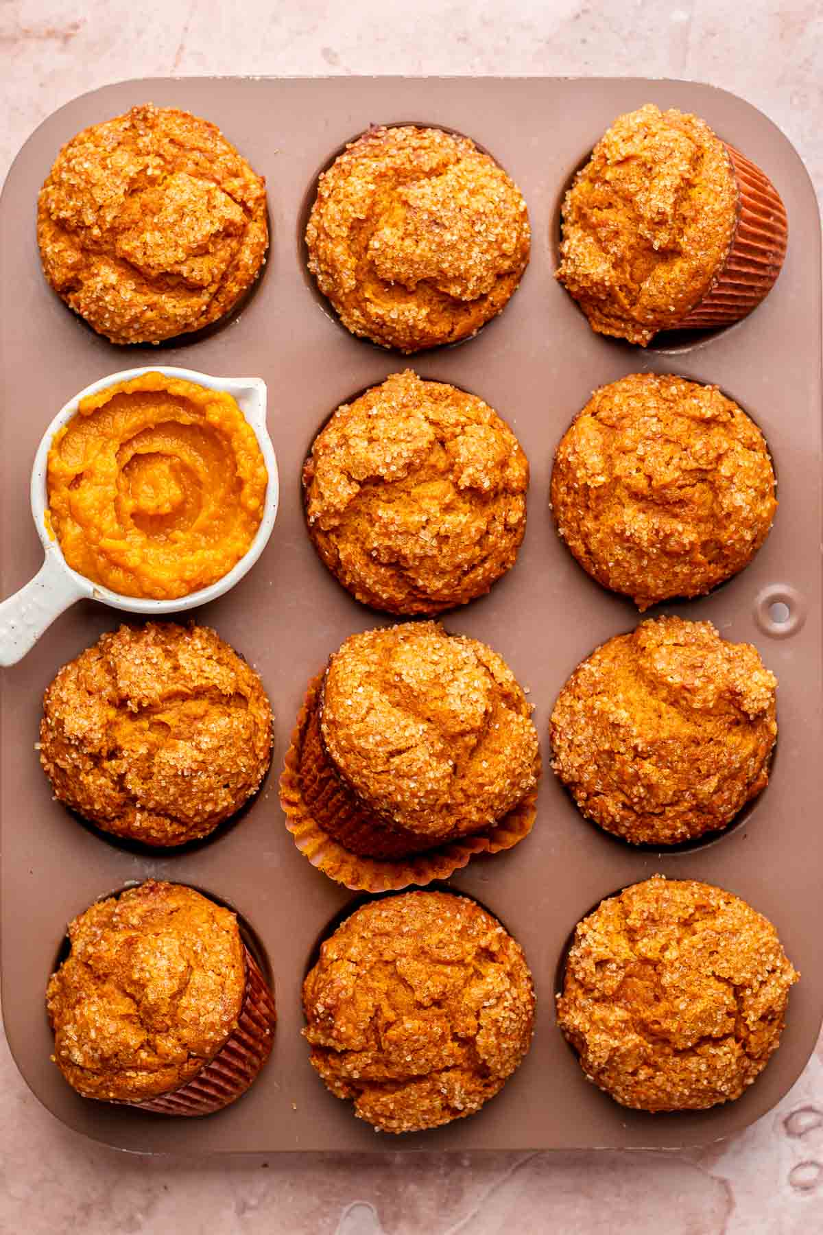 Pumpkin muffins in a muffin tin.