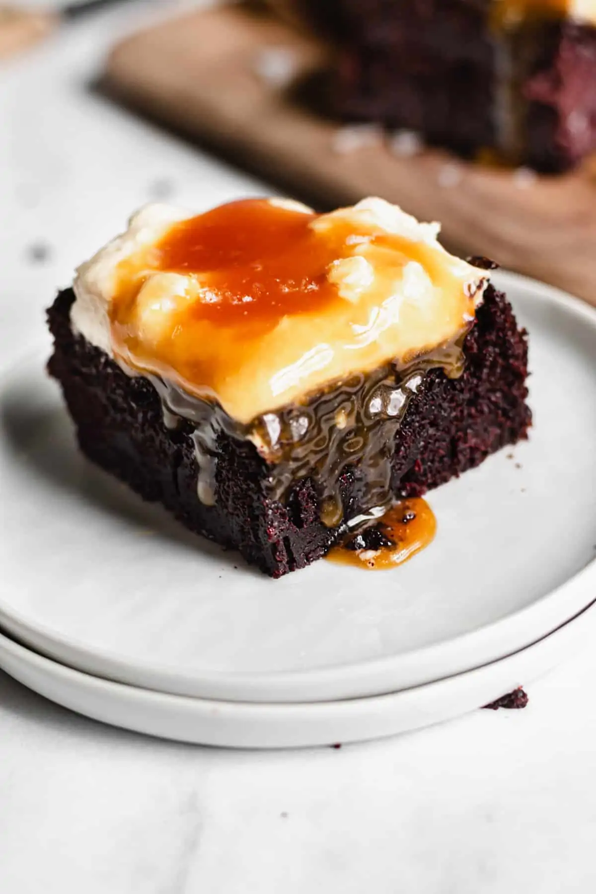 Slice of Chocolate Snack Cake with caramel dripping over the side