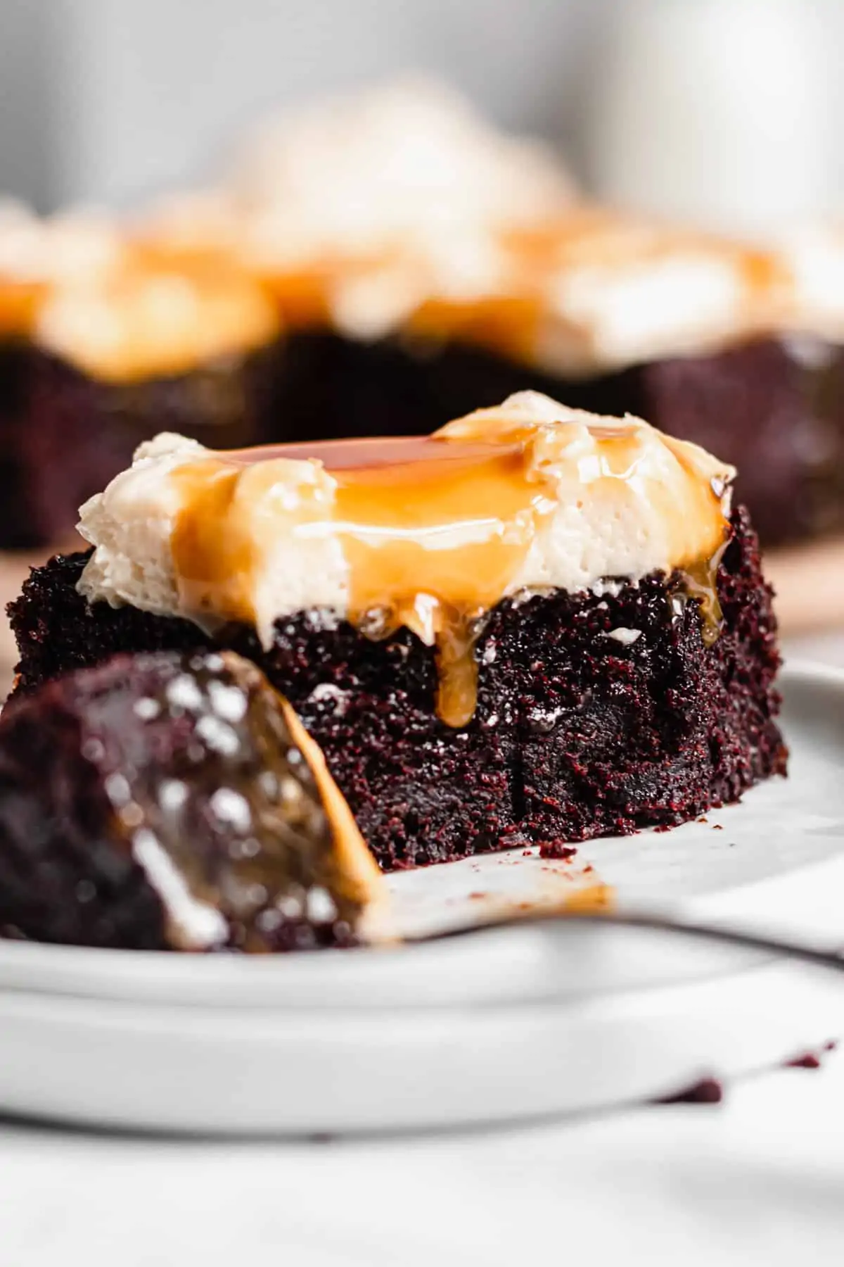 Piece of Chocolate Snack Cake with a corner removed sitting on a fork