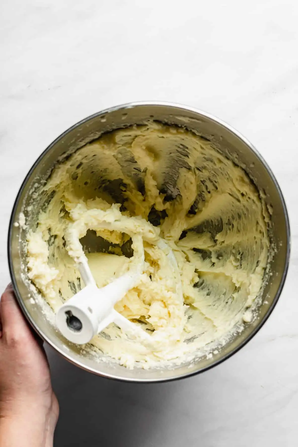 Creamed butter and sugar in a bowl.