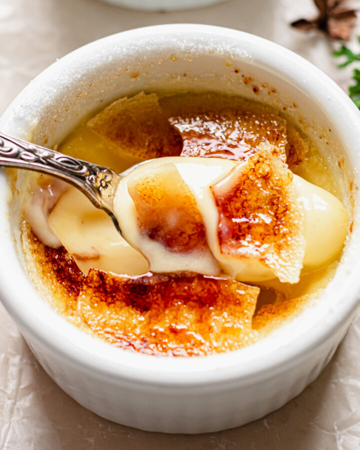 Spoon scooping out eggnog creme brulee