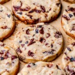 An array of baked slice and bake cookies on a pan.