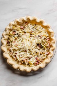 Pie crust filled with ham, leeks, and Swiss cheese.