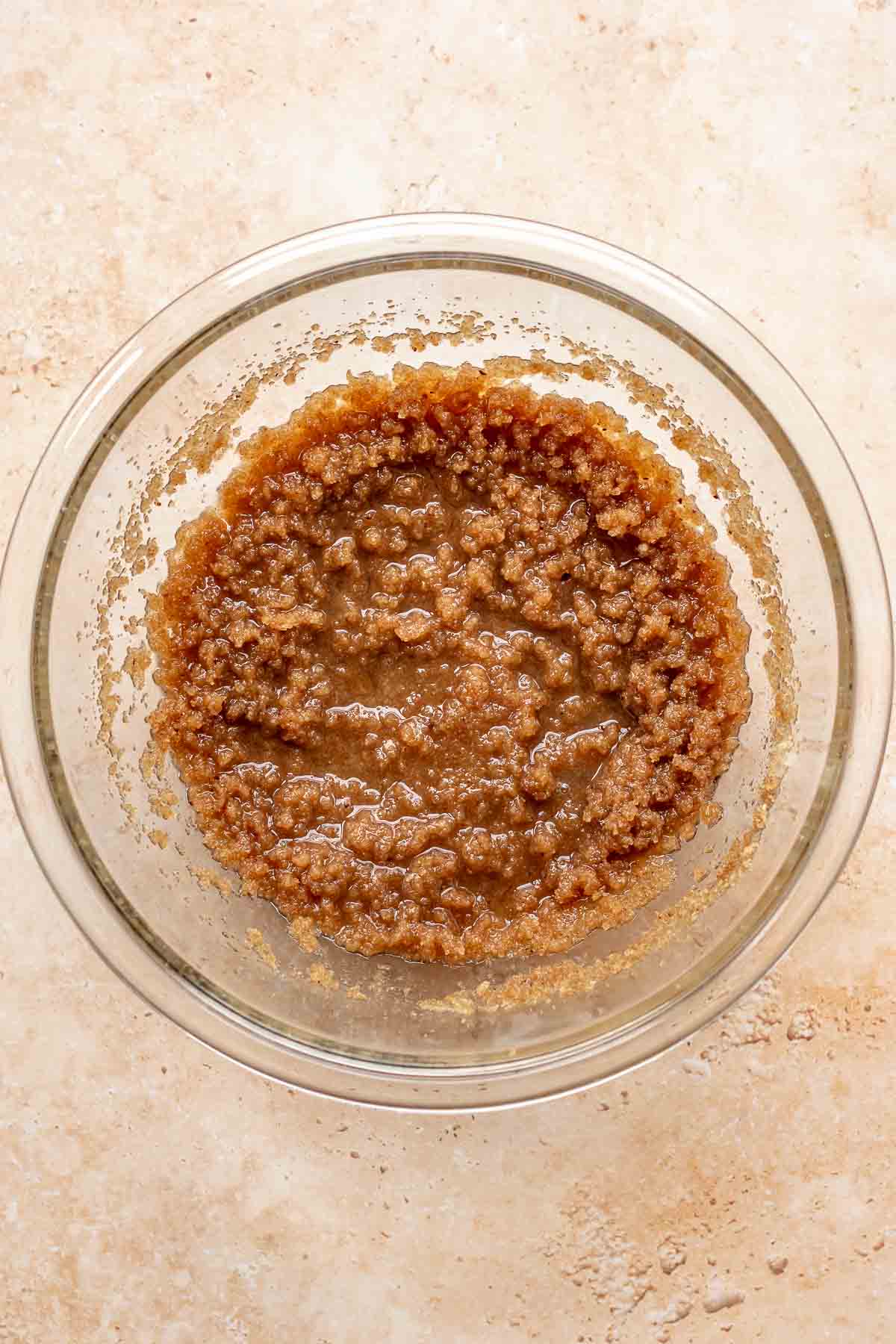 Butter and sugars mixed in a bowl.