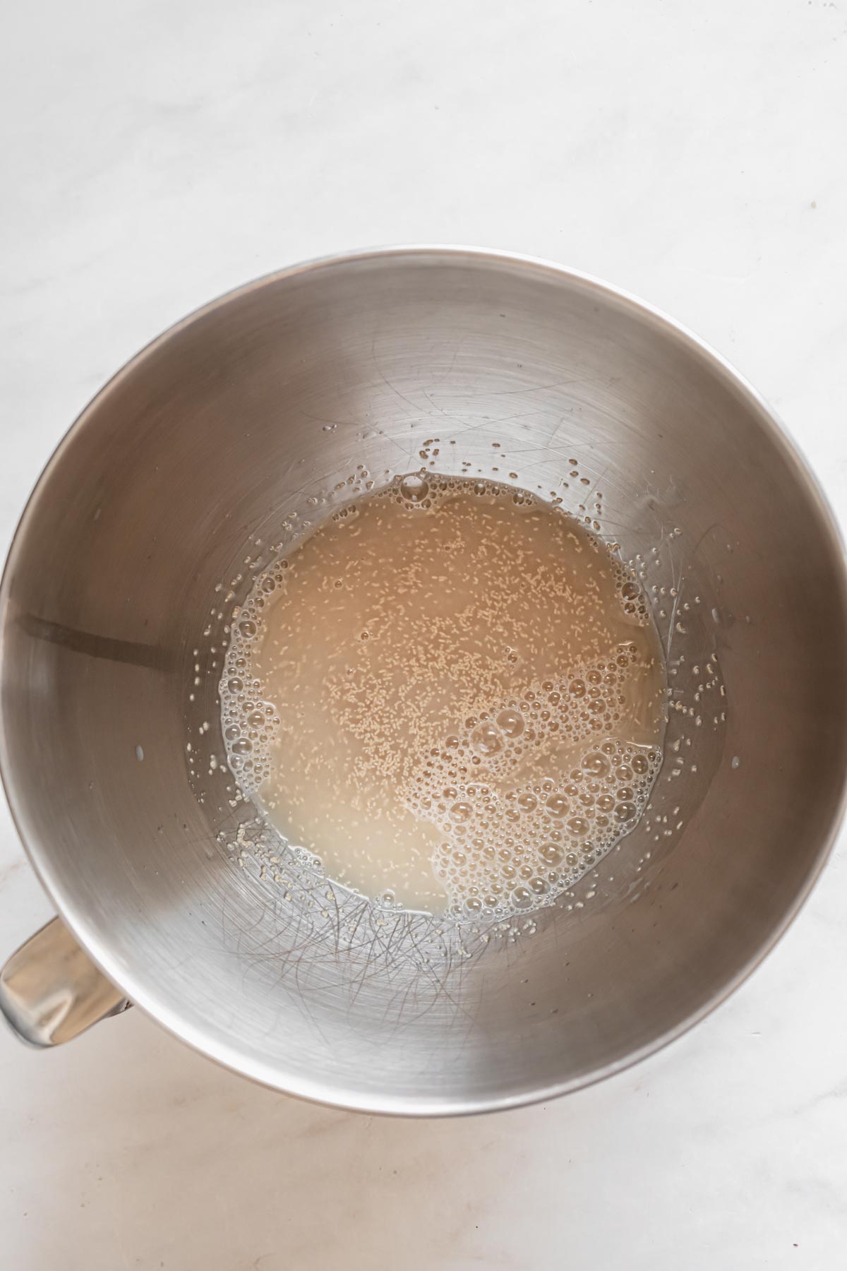 Yeast water and sugar mixed together in a bowl.