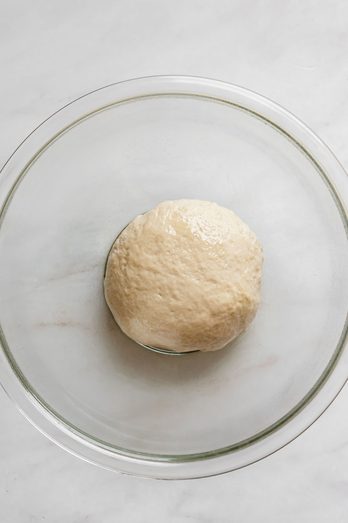 Ball of dough in a greased bowl.