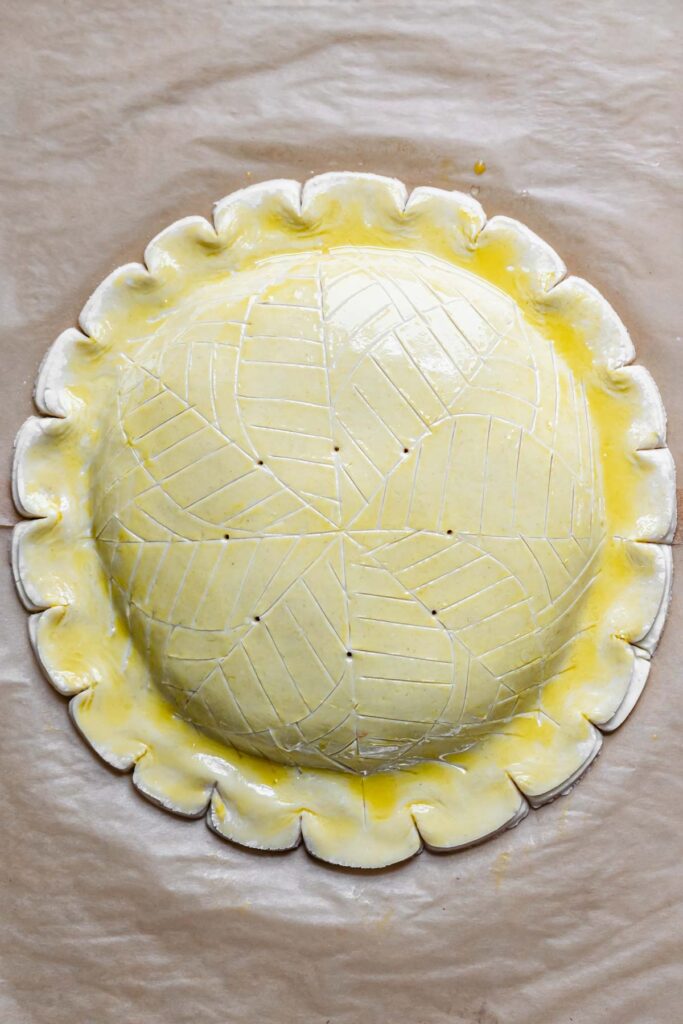 Overhead shot of the designed and pre-baked galette des rois.