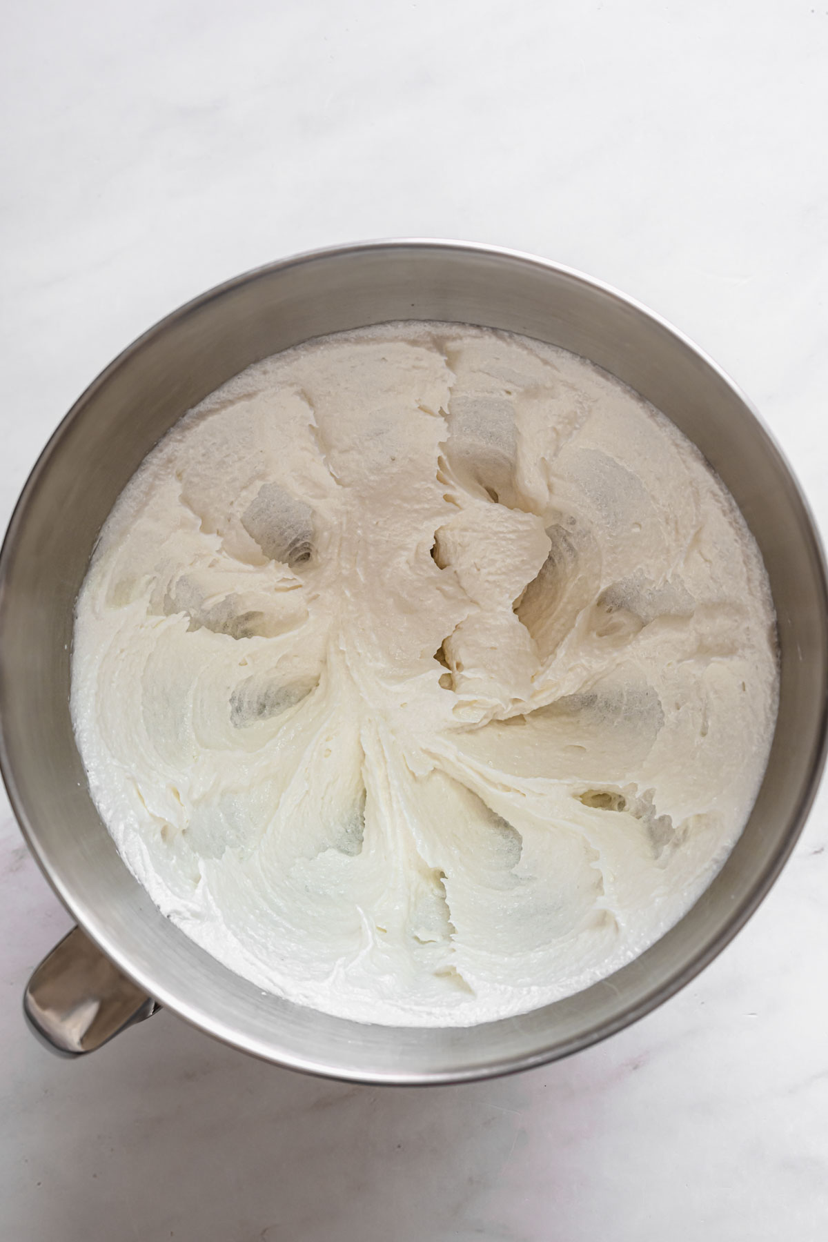 The first ingredients of the cupcake batter whipped together in the bowl of a stand mixer