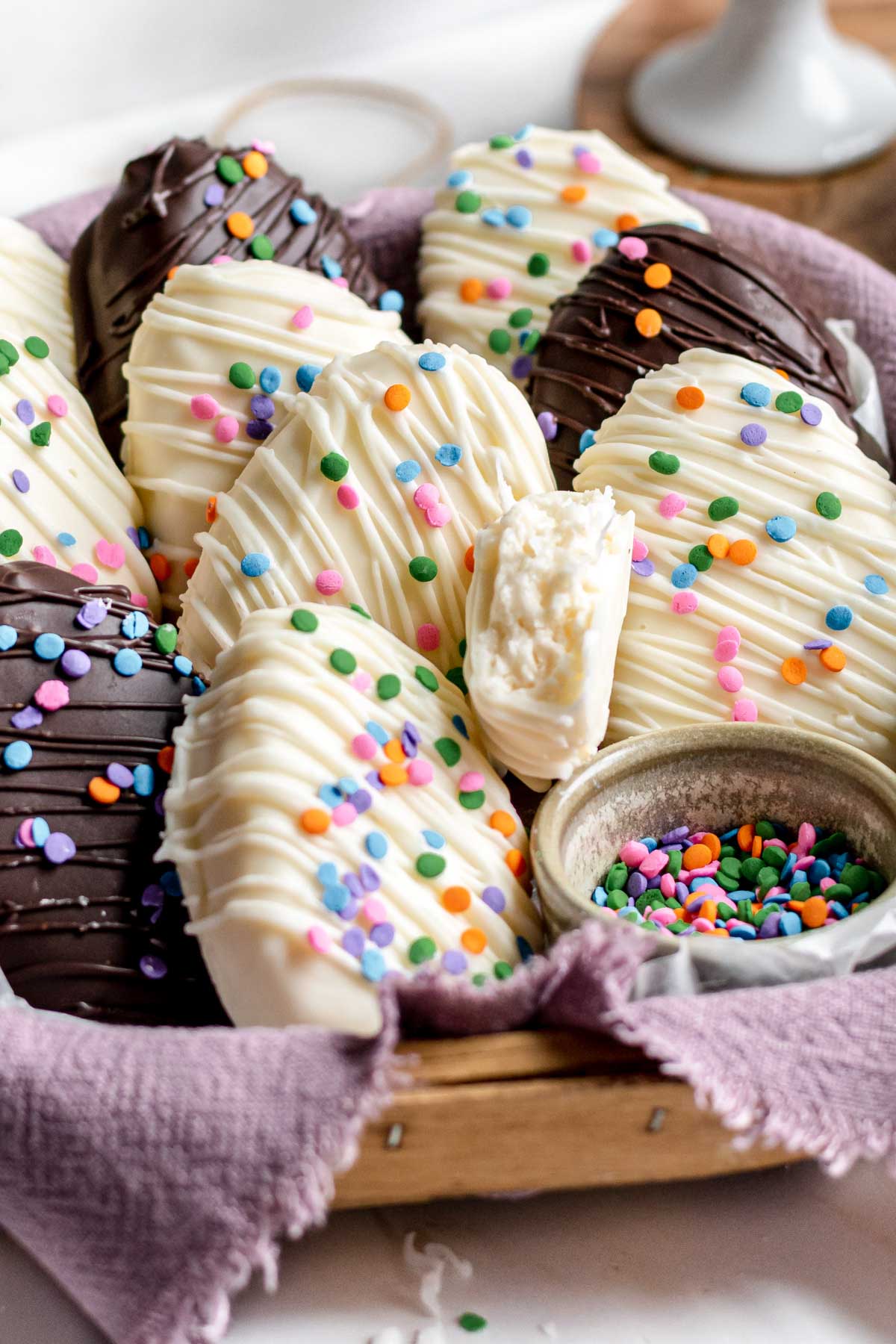 Basket of coconut cream eggs with sprinkles.
