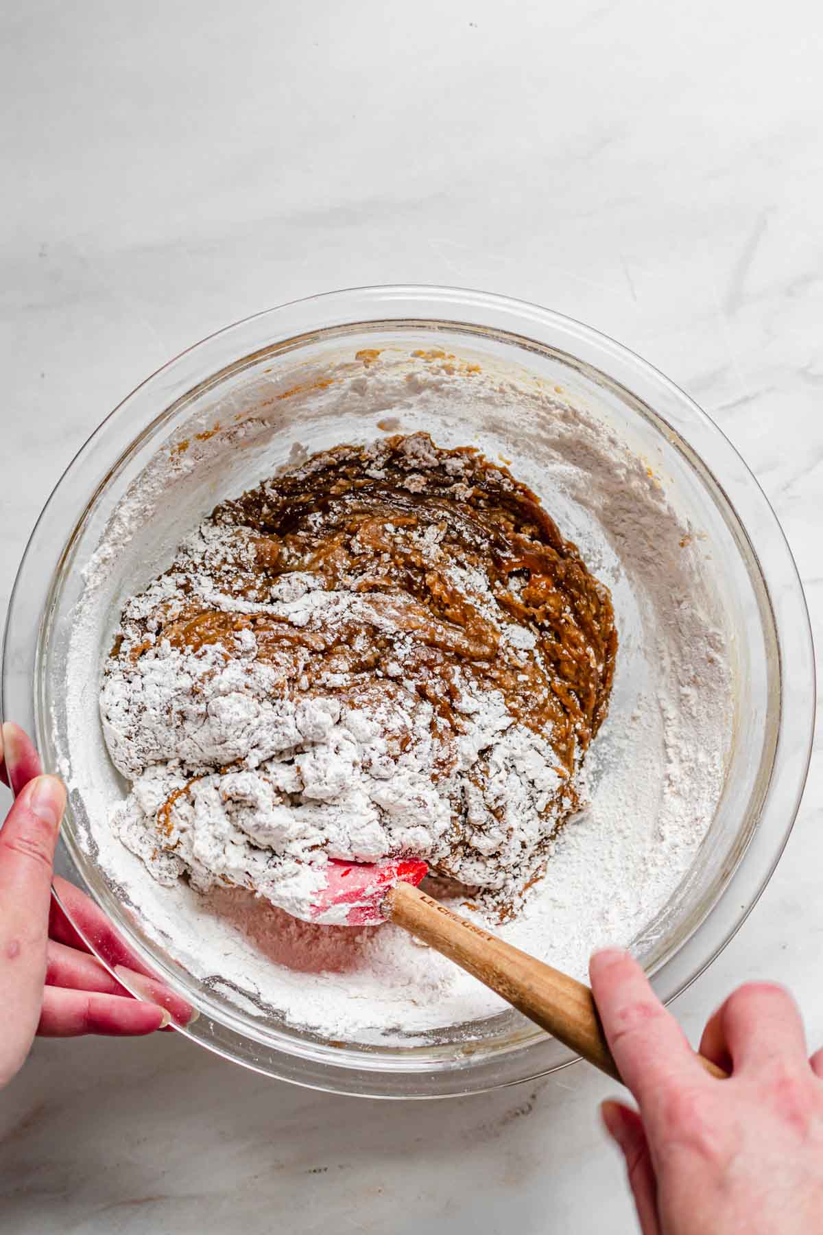 Flour being folded into the batter.