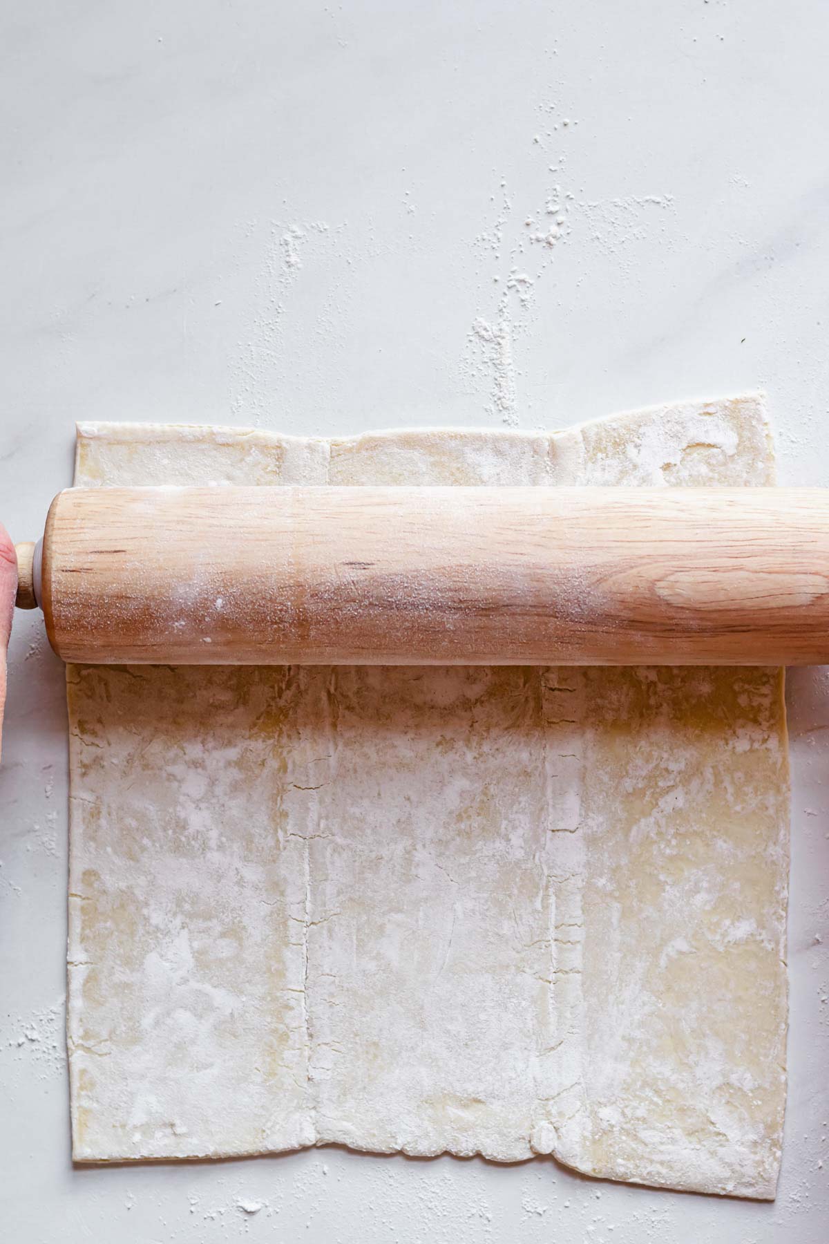 Rolling out the puff pastry.