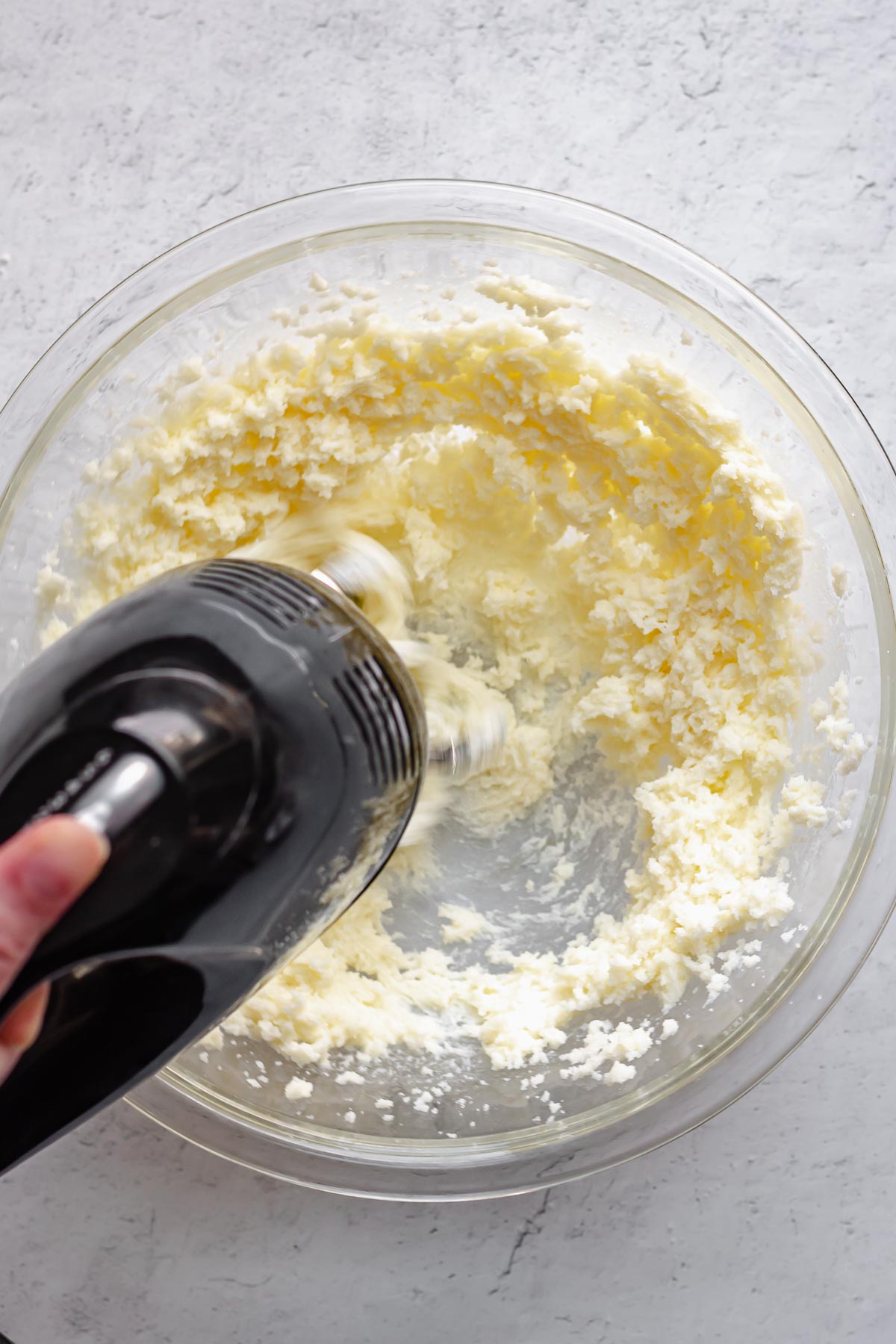 Butter and sugar beating together with a hand mixer