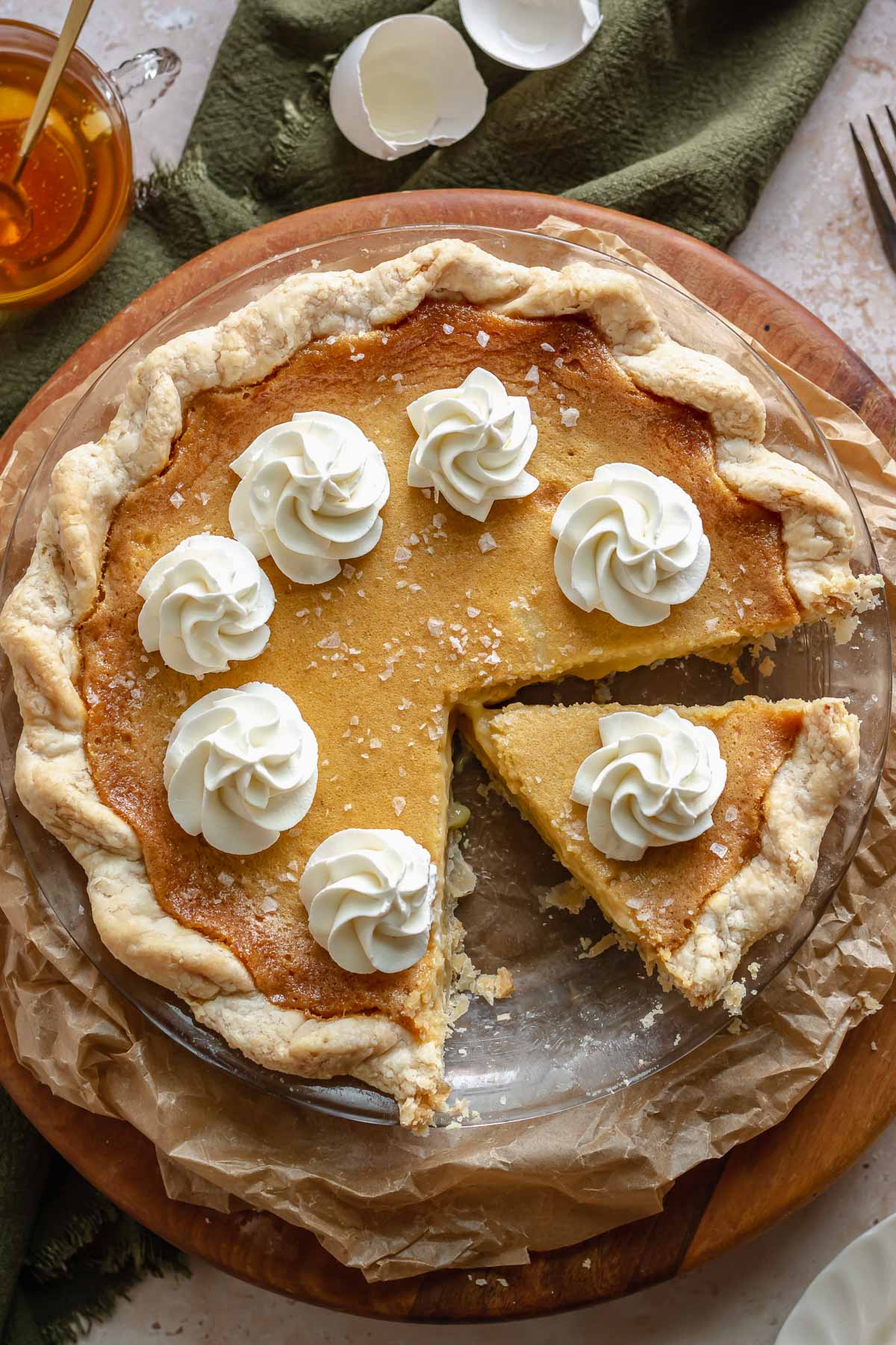 Honey chess pie with a slice removed.