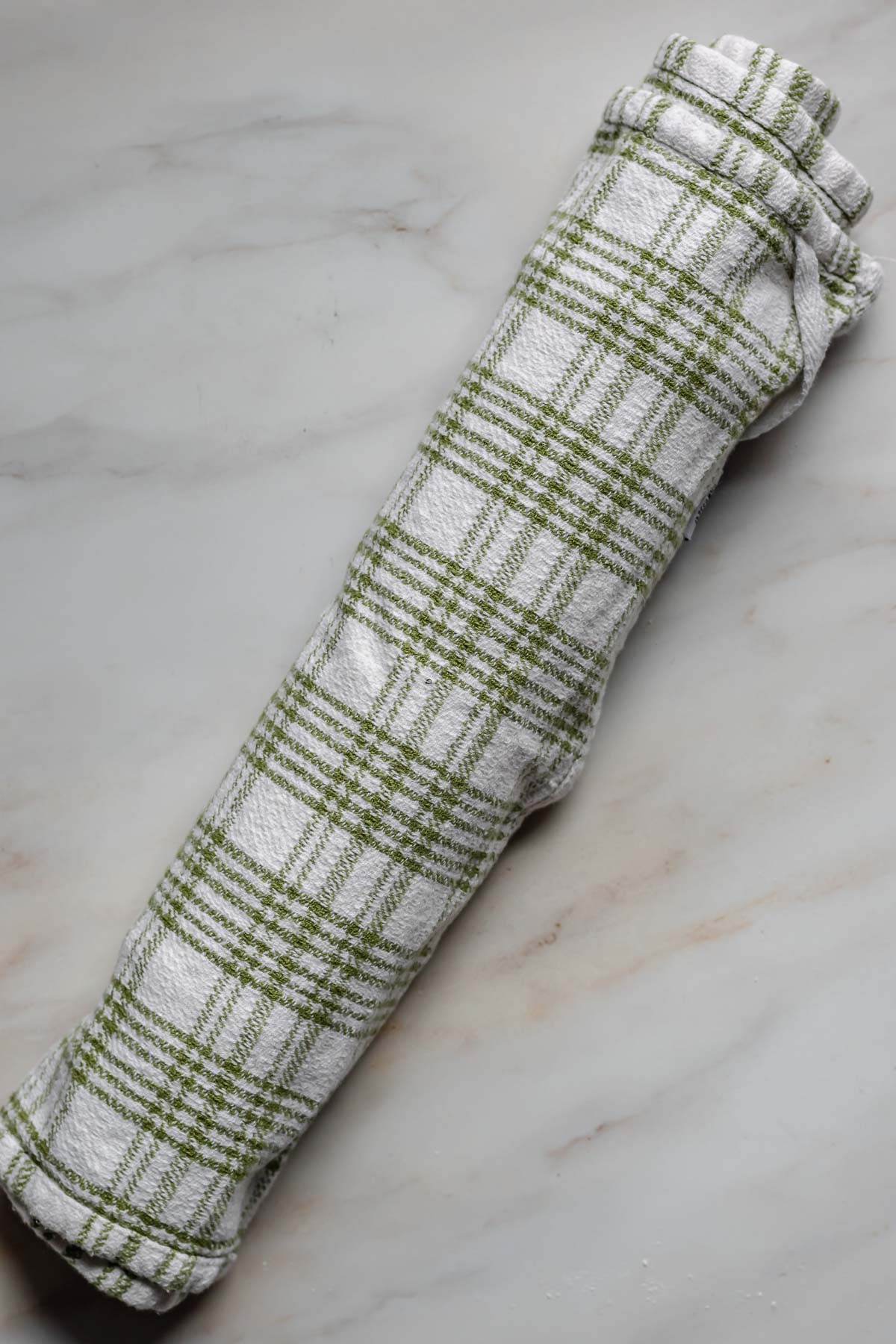 Swiss roll in a kitchen towel.
