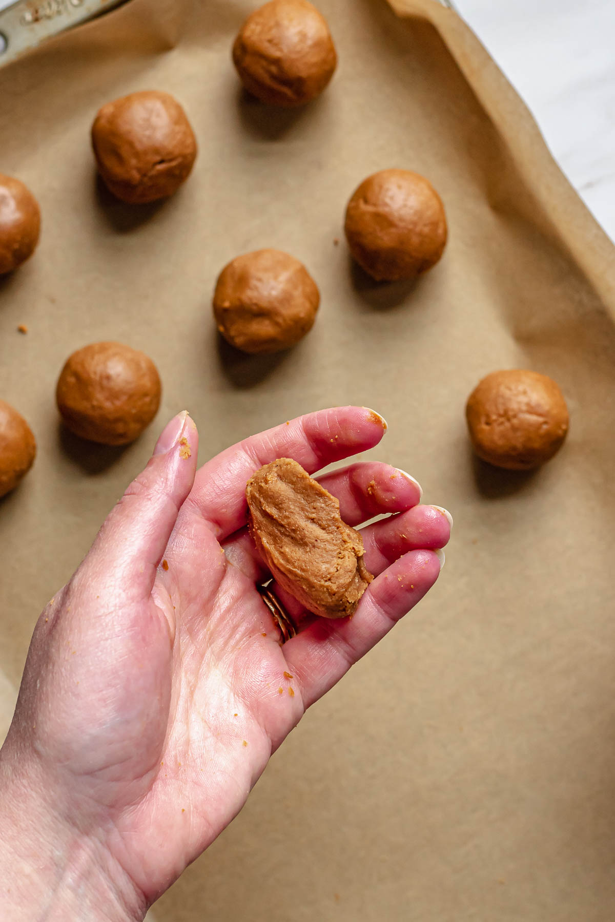 Biscoff truffle in a hand.