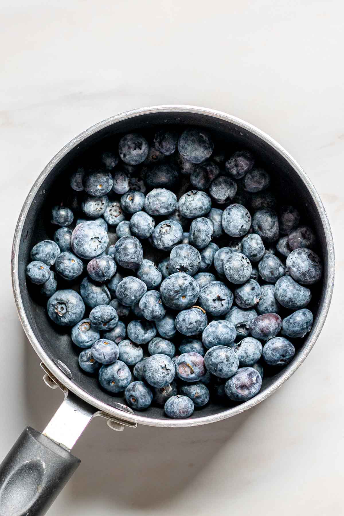 Blueberries in a small saucepan.