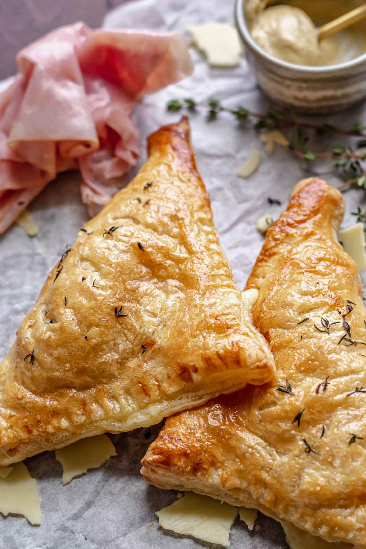 Two ham and cheese turnovers.