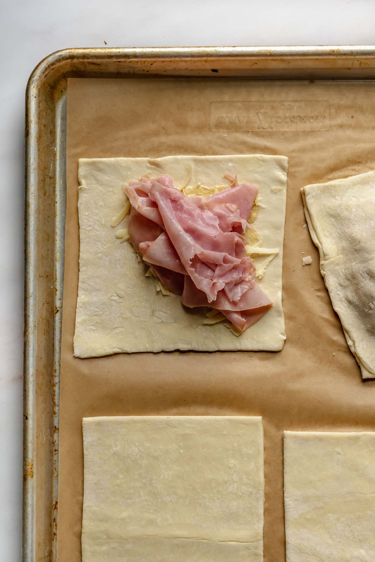 Ham on a puff pastry square.