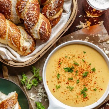 A basket of soft pretzels with beer cheese dip.