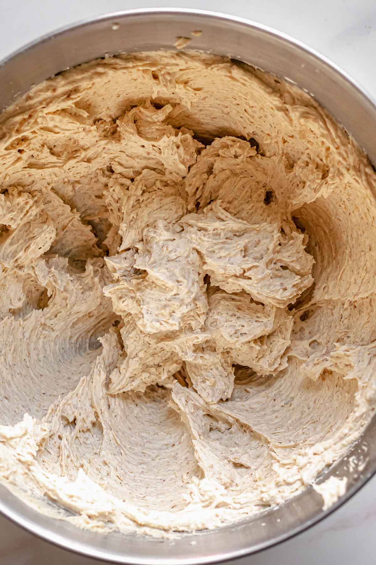 Graham cracker buttercream frosting in a mixing bowl.