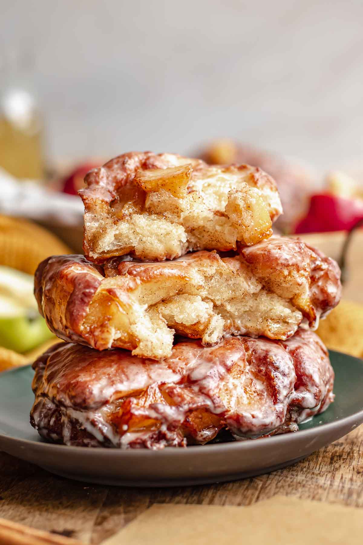 A stack of apple fritters on a plate.