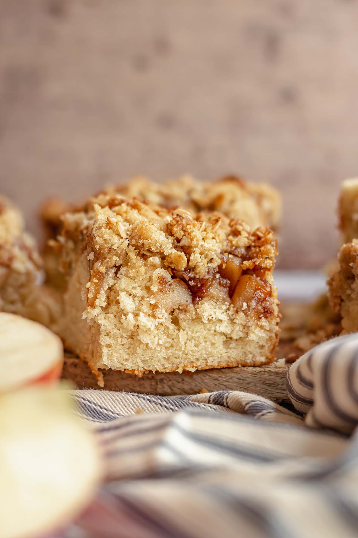 One slice of apple coffee cake showing the layers.