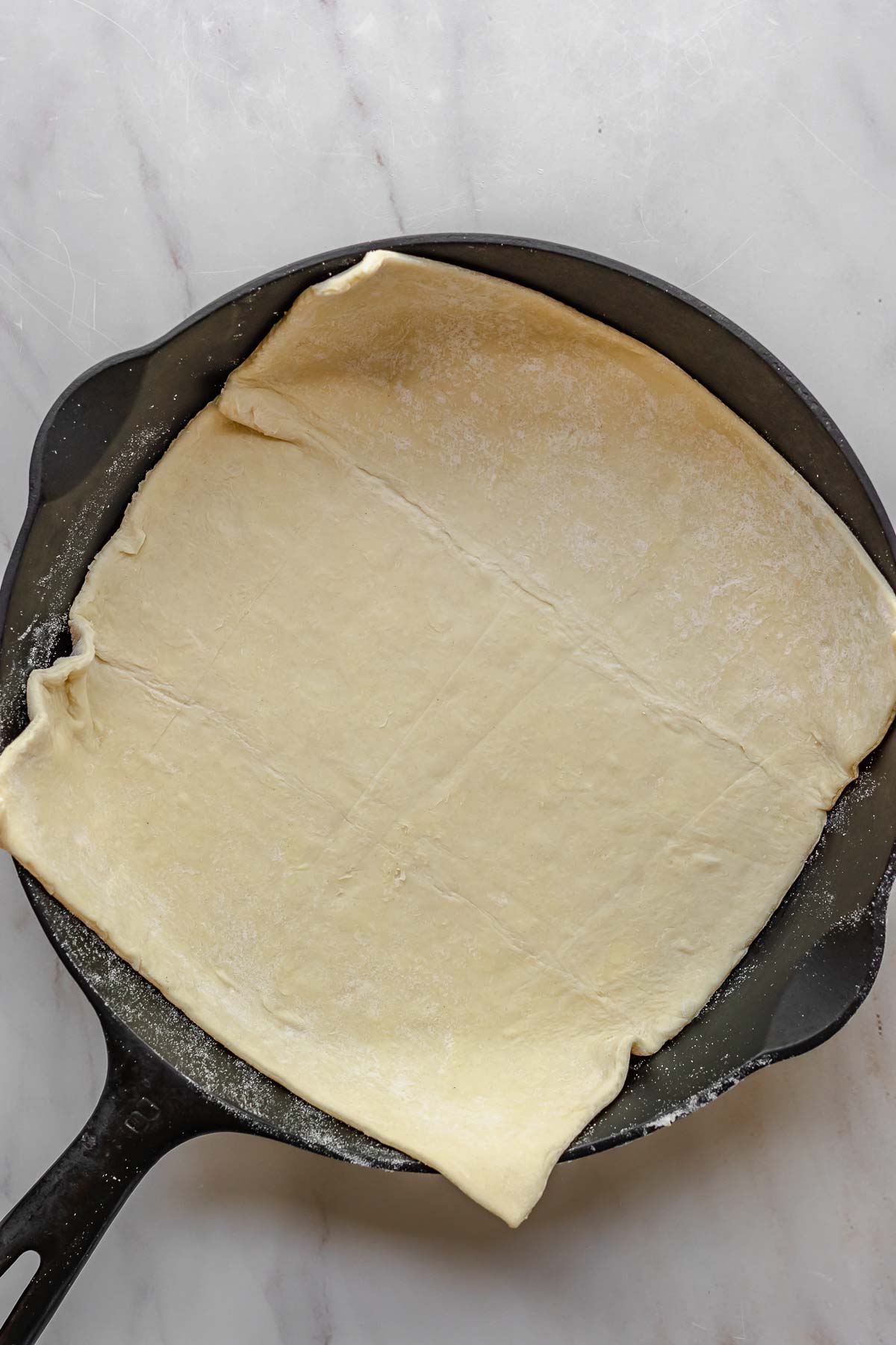 Puff pastry in a cast iron skillet.